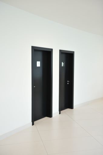 A pair of doors to restrooms
